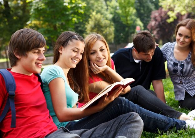Young college students relaxing outdoors